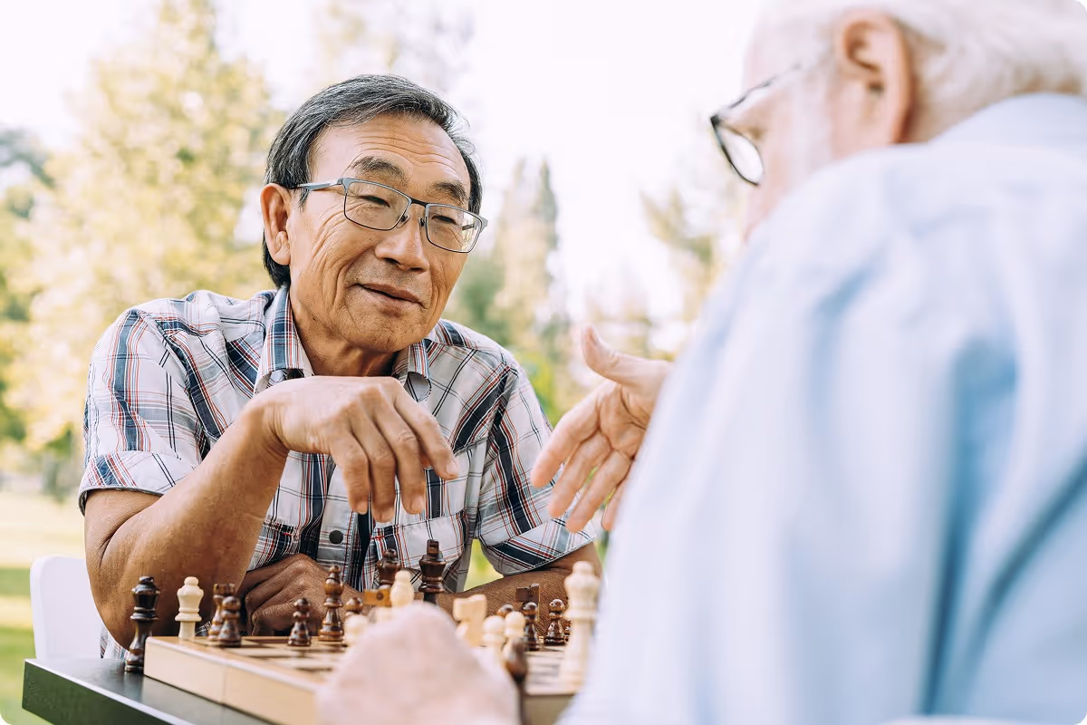 Two elderly men playing chess.