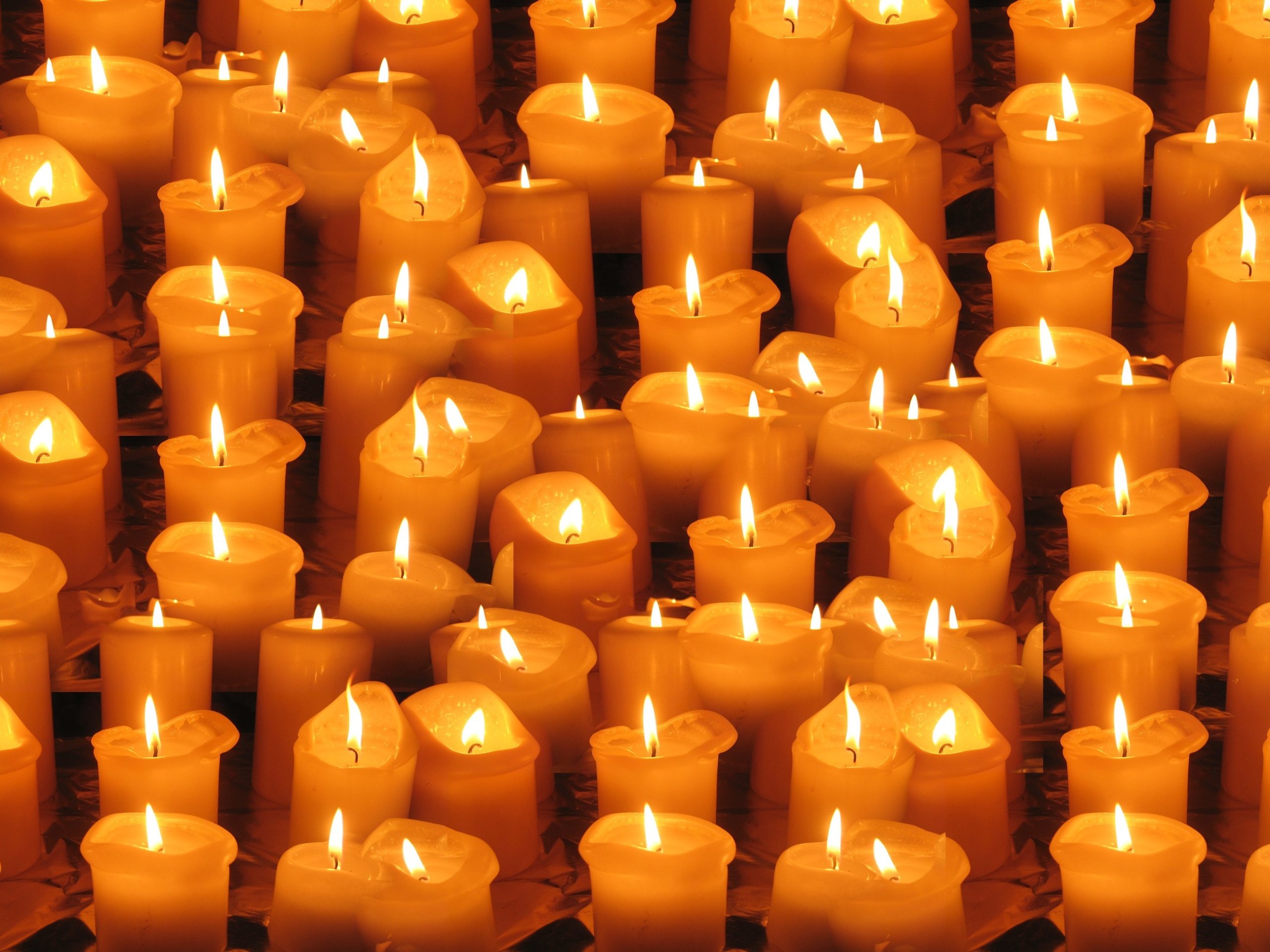 Lit candles in memory of someone who died by suicide